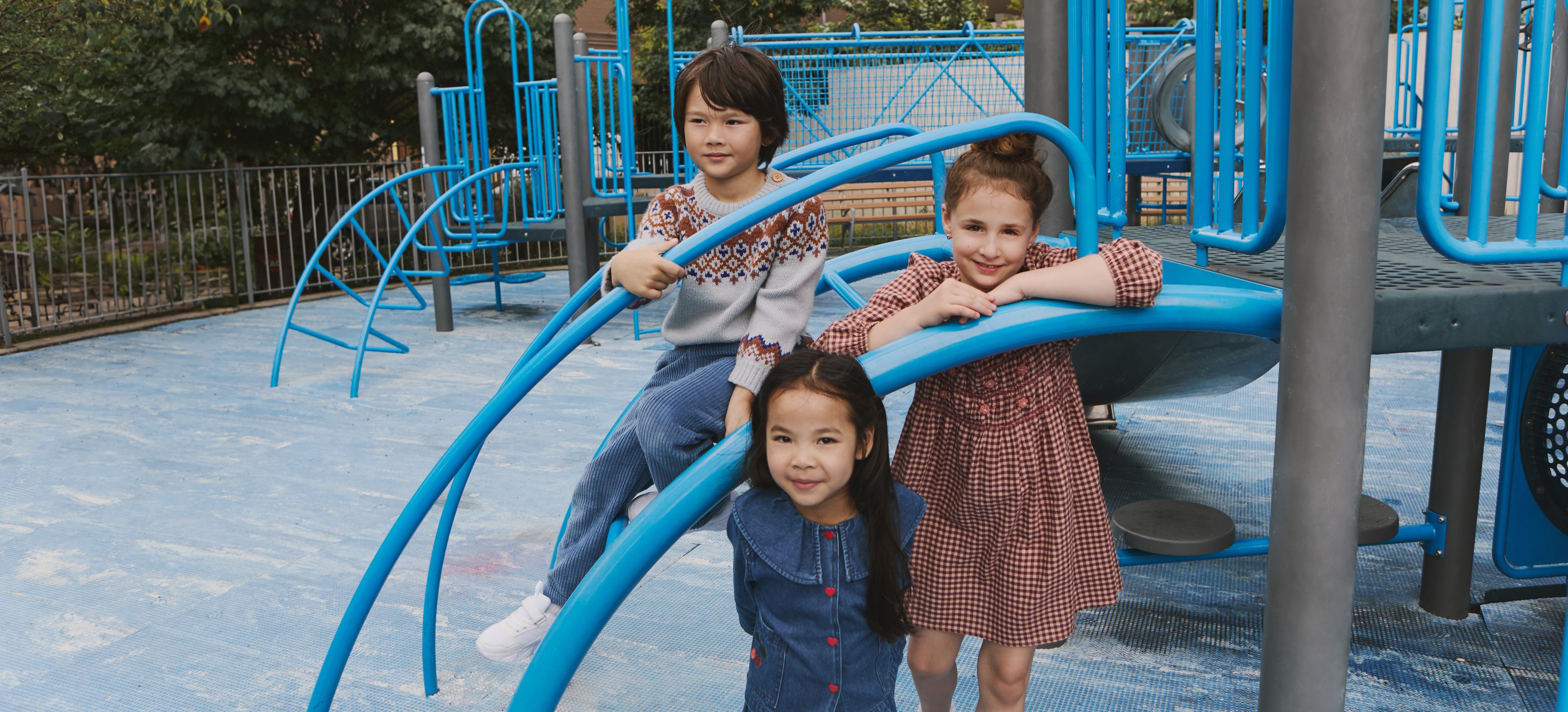 three kids in the playground