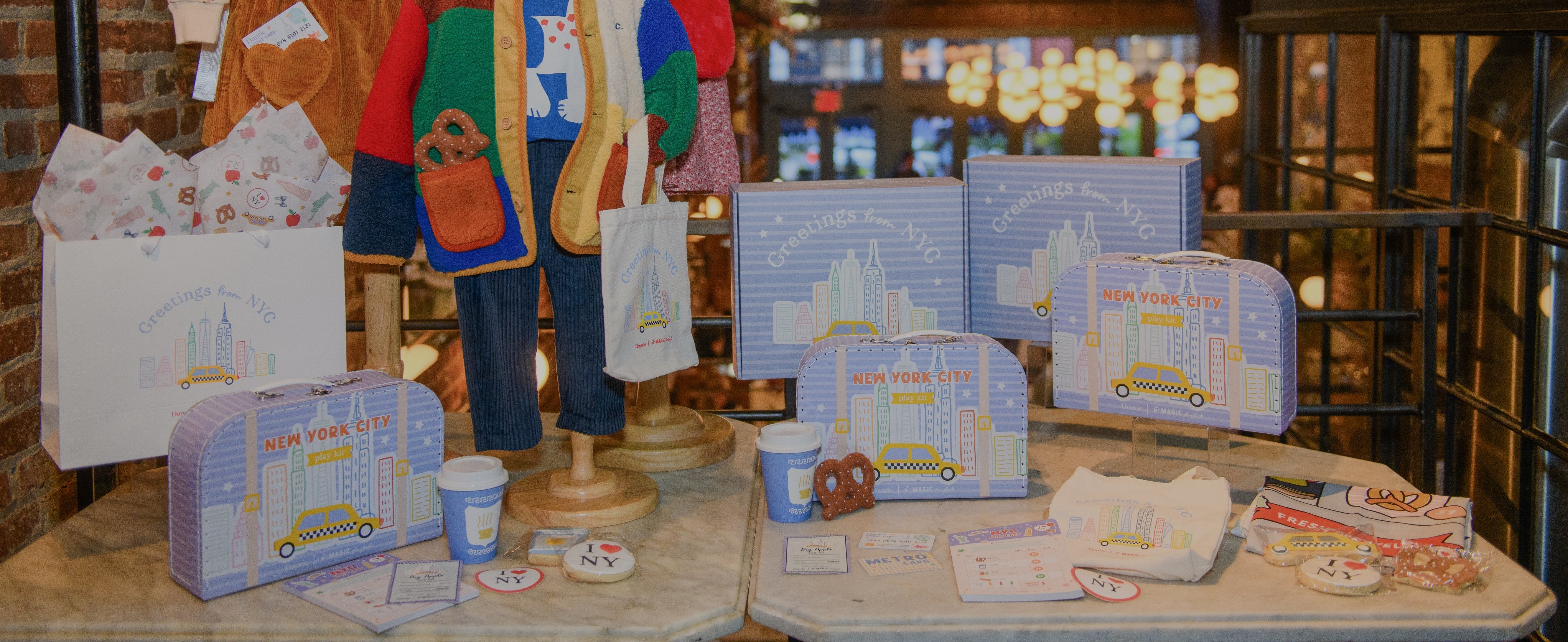 NYC play kit, and apparel on a table
