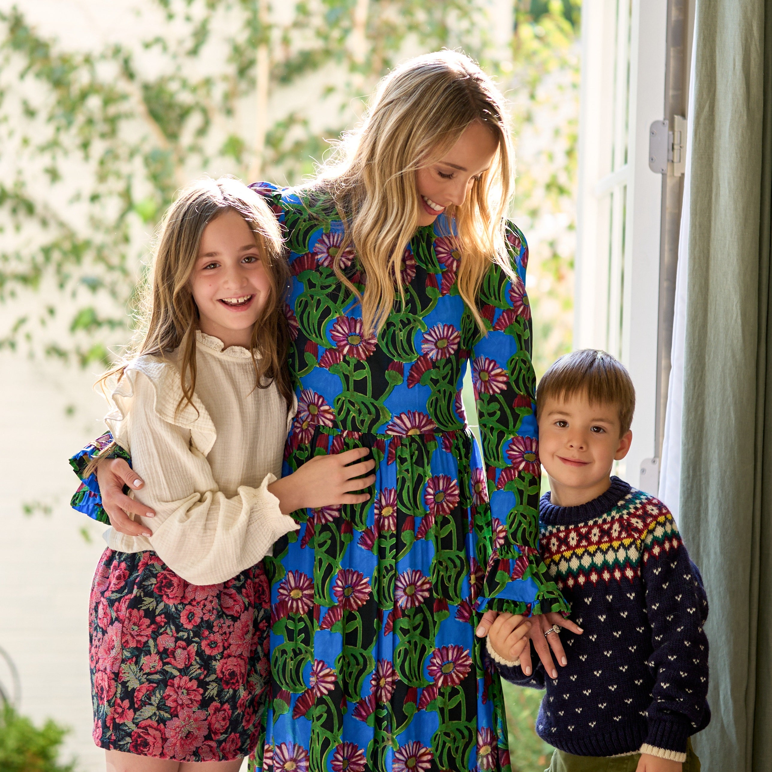 mom and daughter and son posing for photo