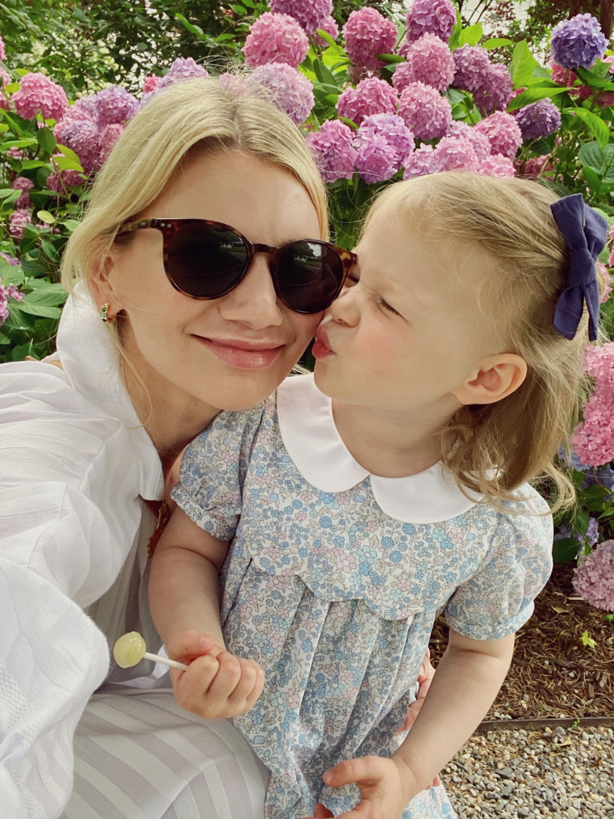 mom taking selfie with daughter