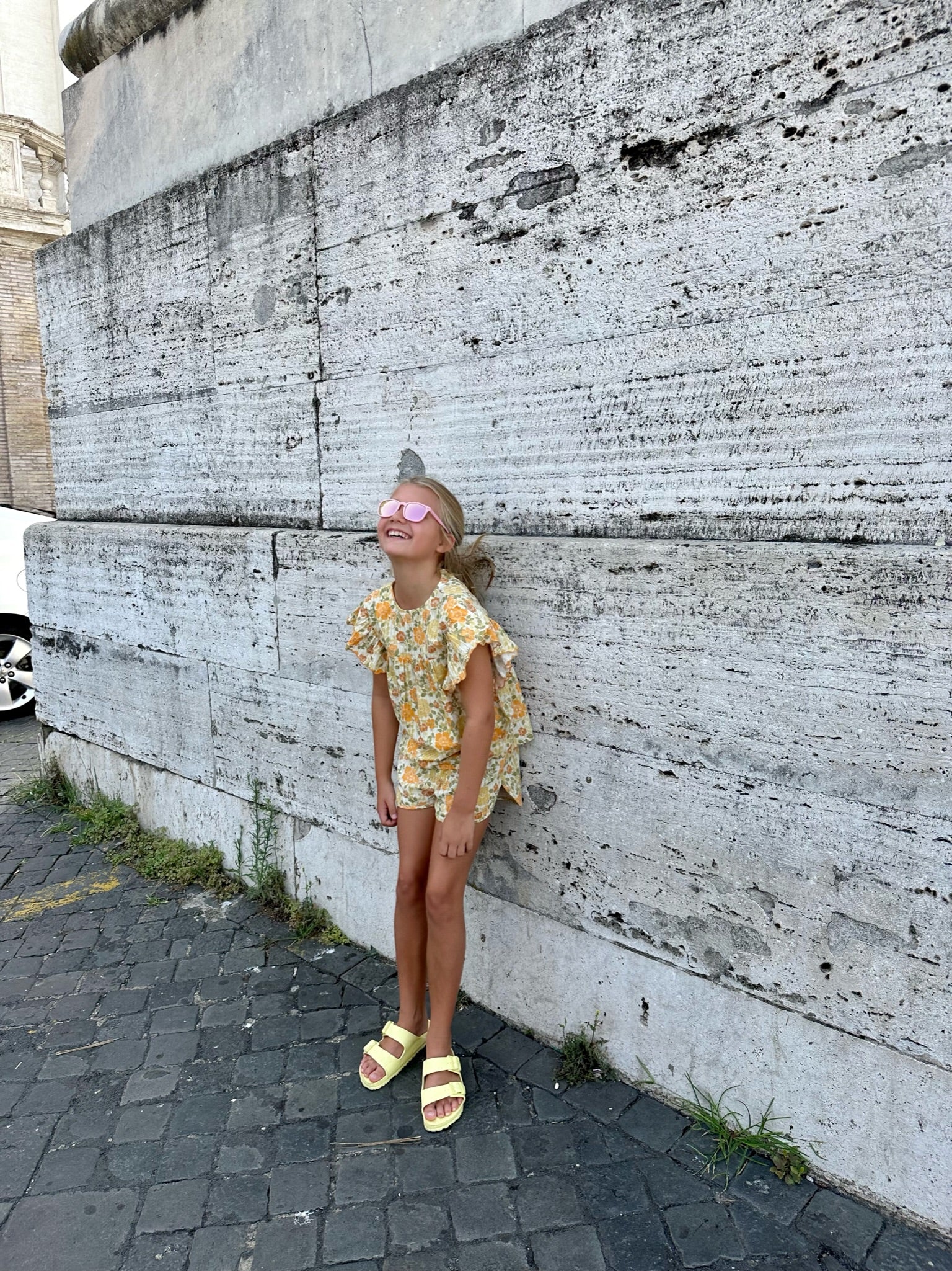 young girl wearing yellow floral set