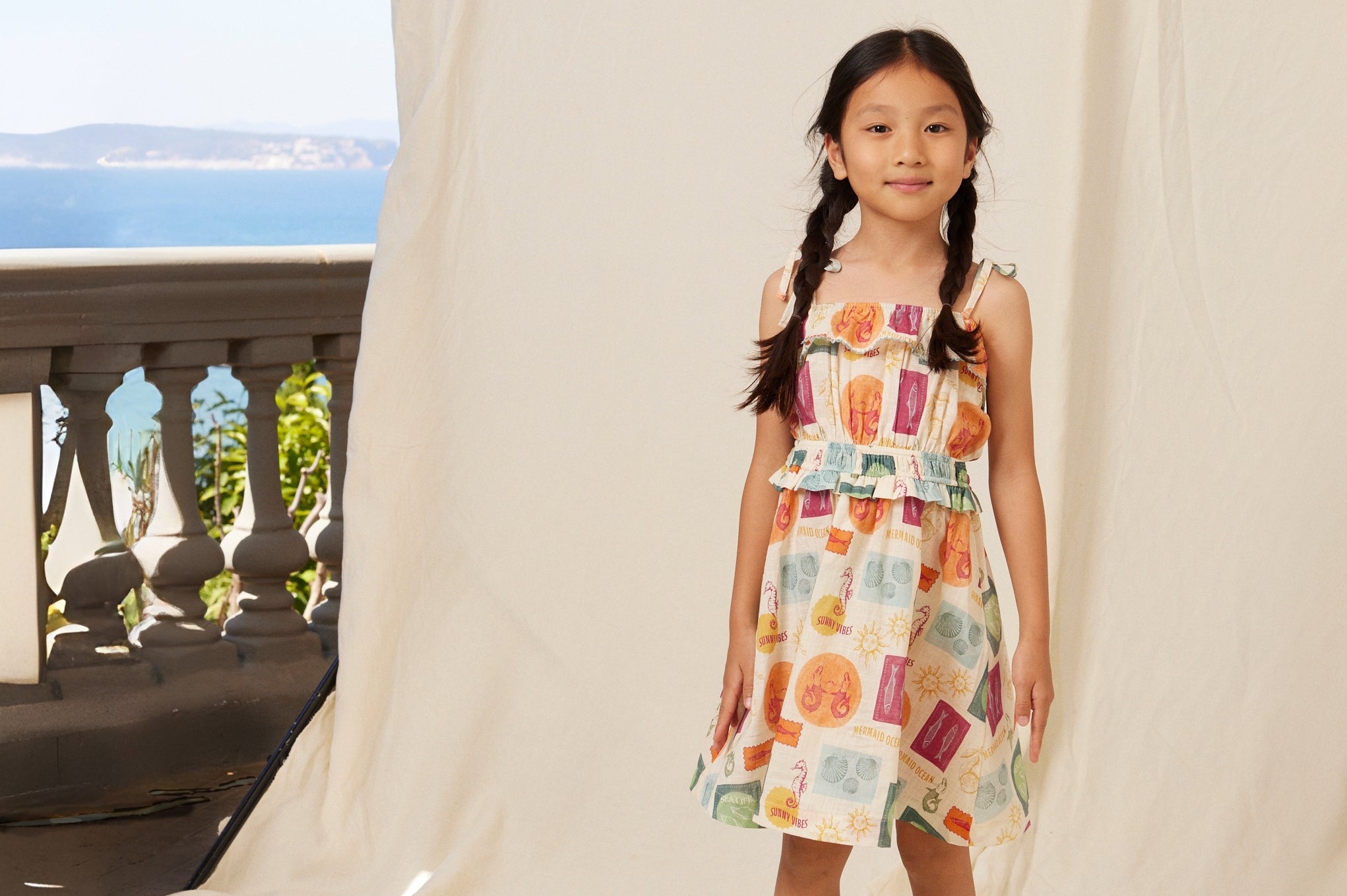 girl wearing bebe organic lola dress