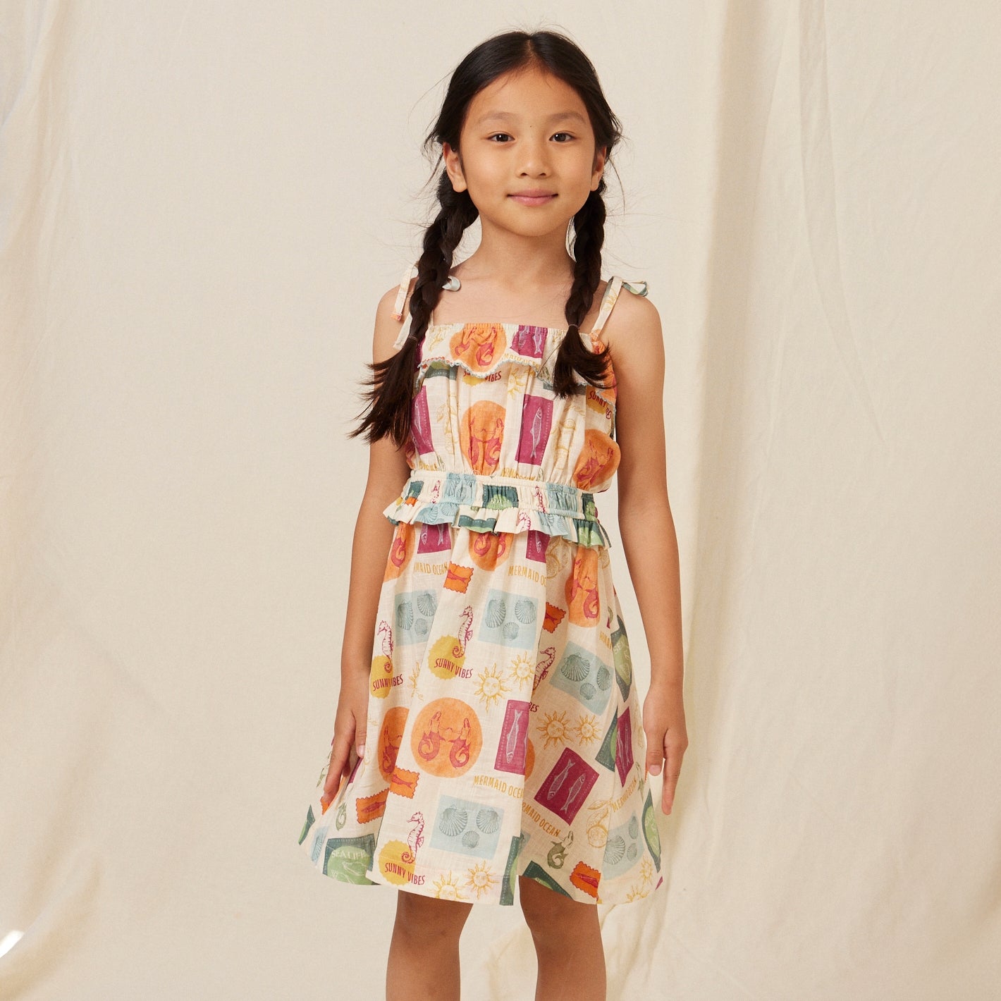girl wearing bebe organic lola dress
