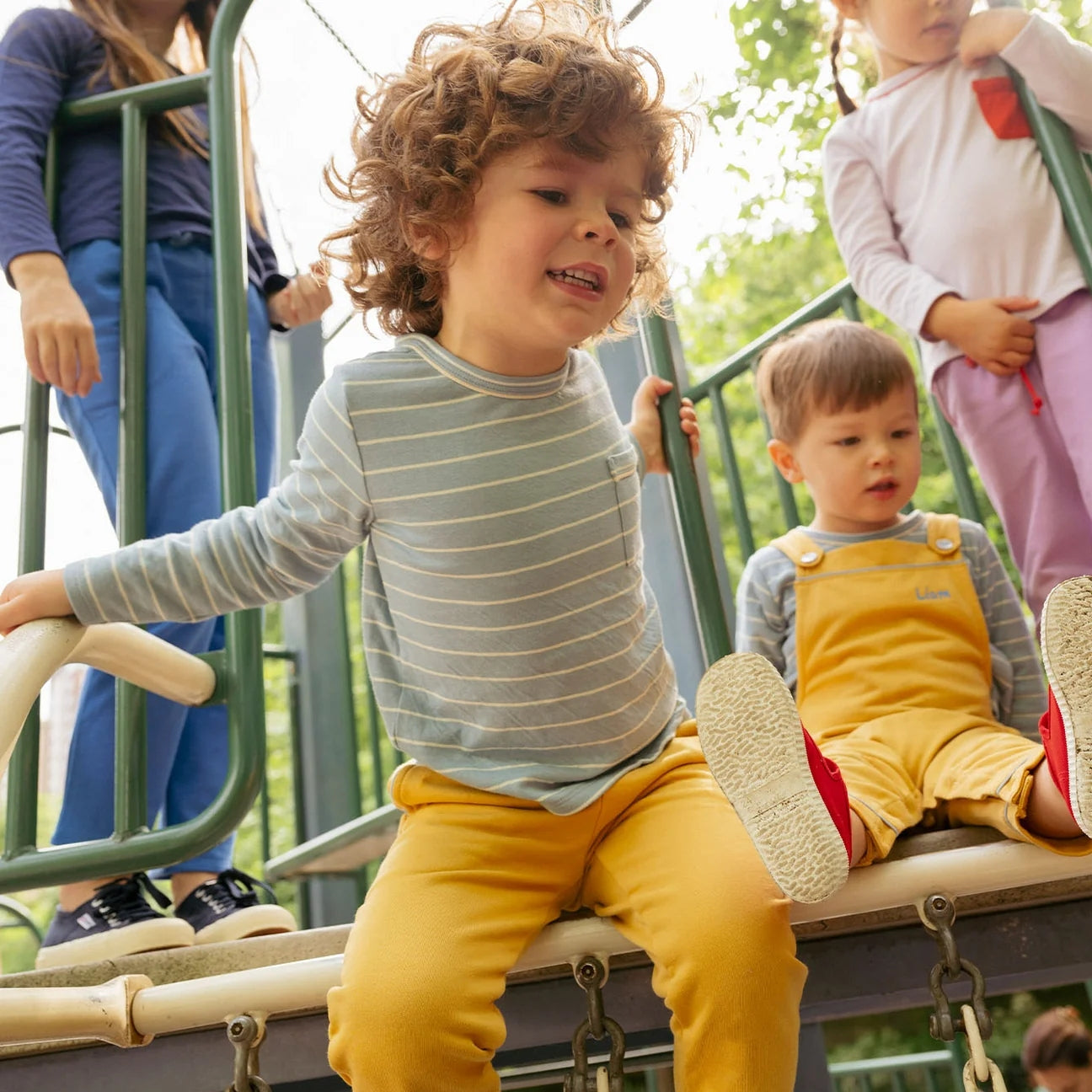 boy on playground wearing edward long sleeve t-shirt