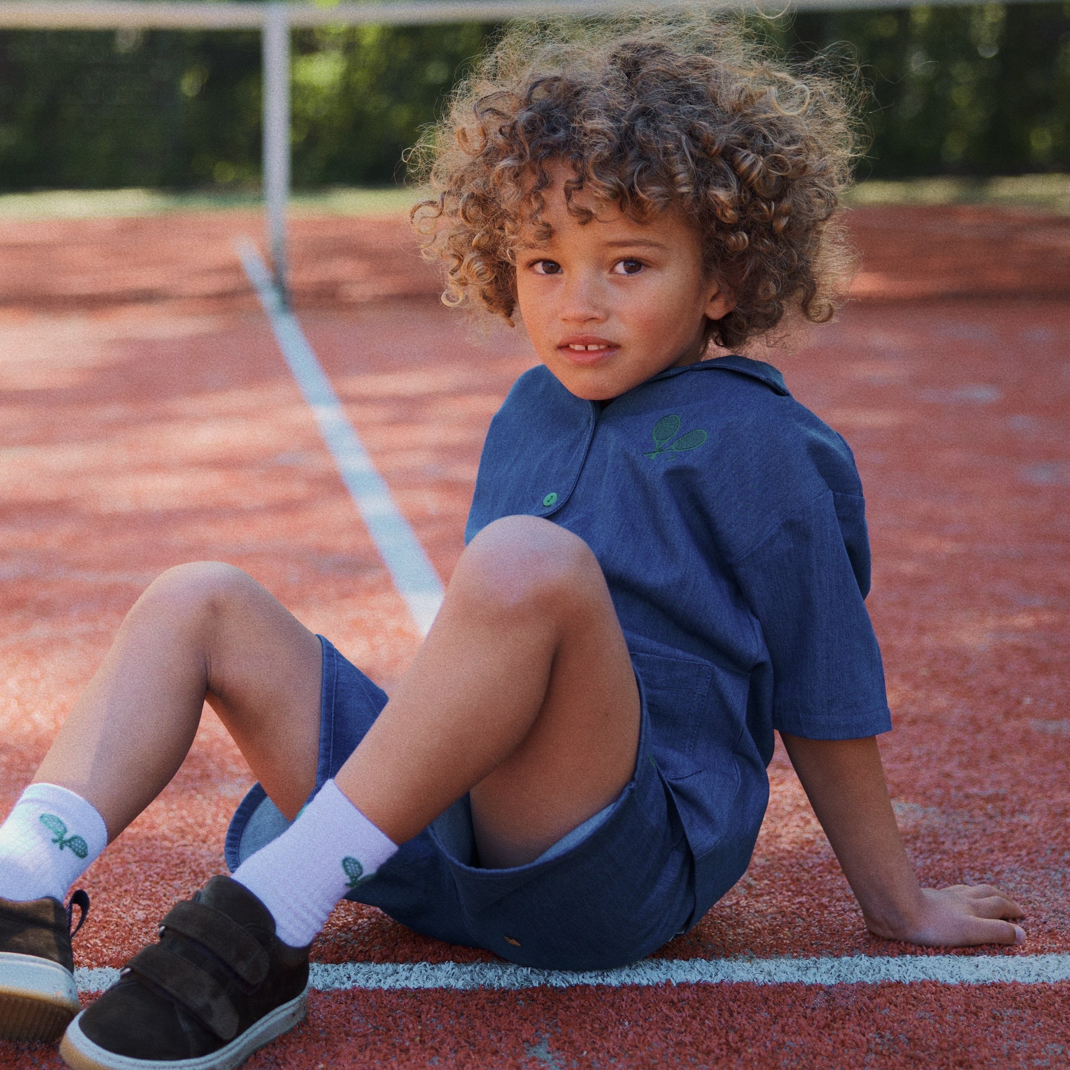 boy wearing victor shirt and shorts set