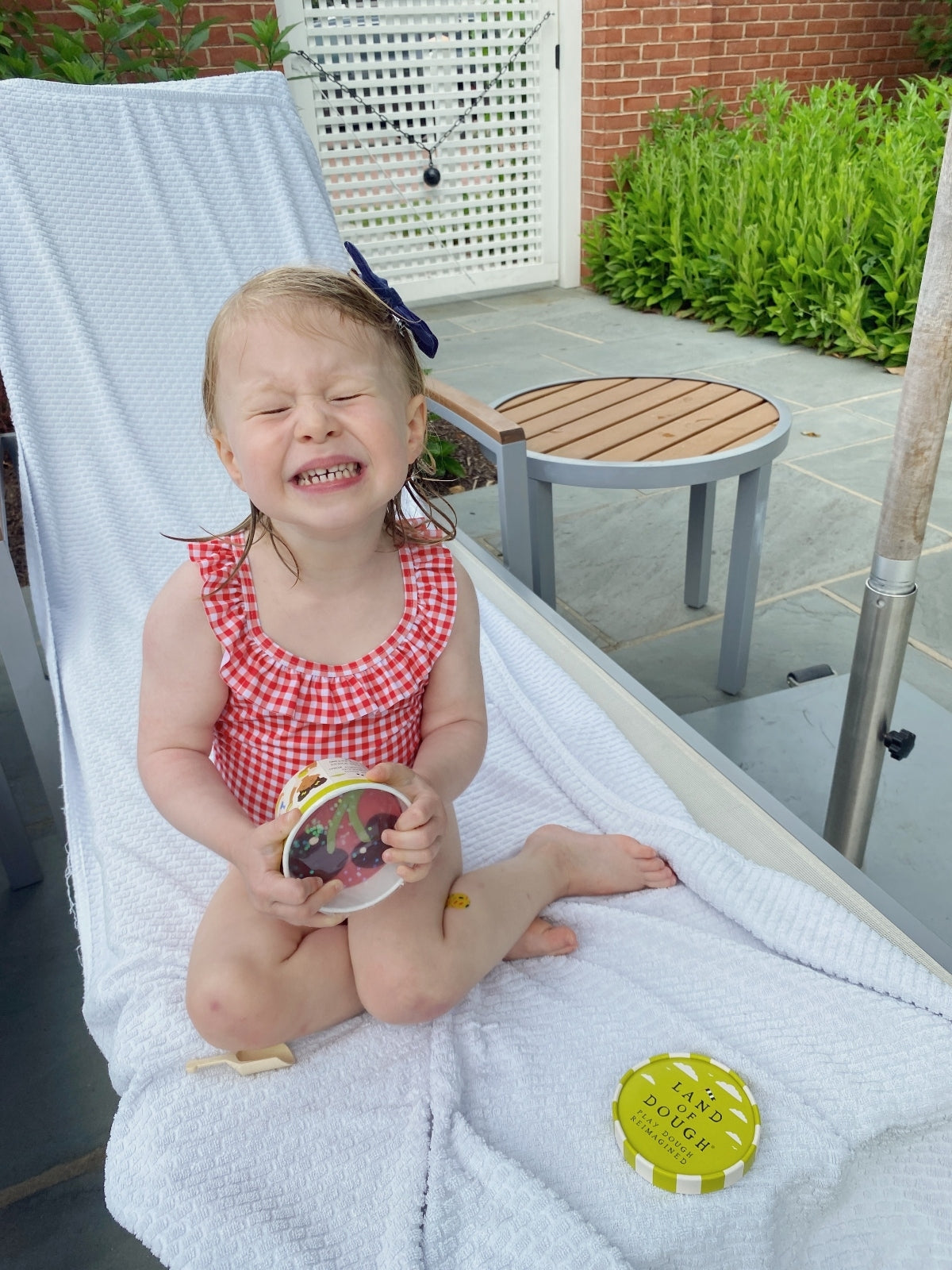 little girl in red bathingsuit