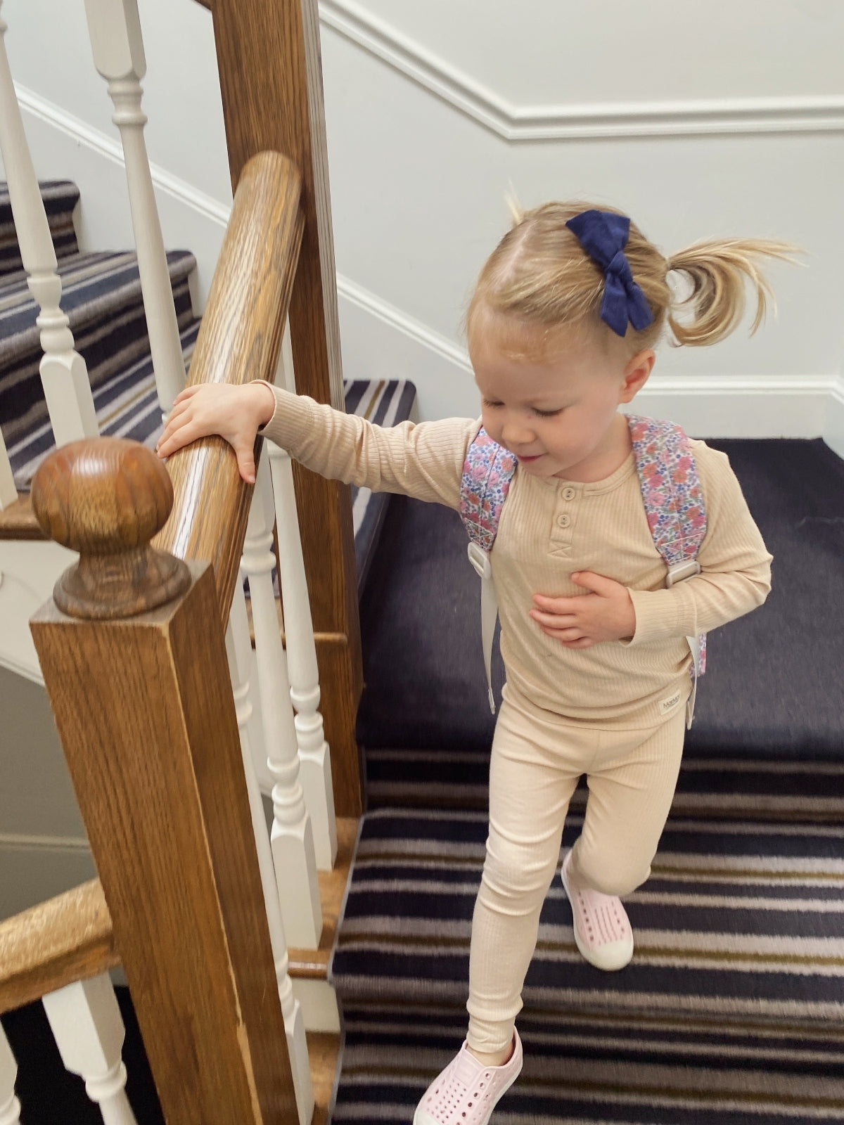 girl walking down stairs