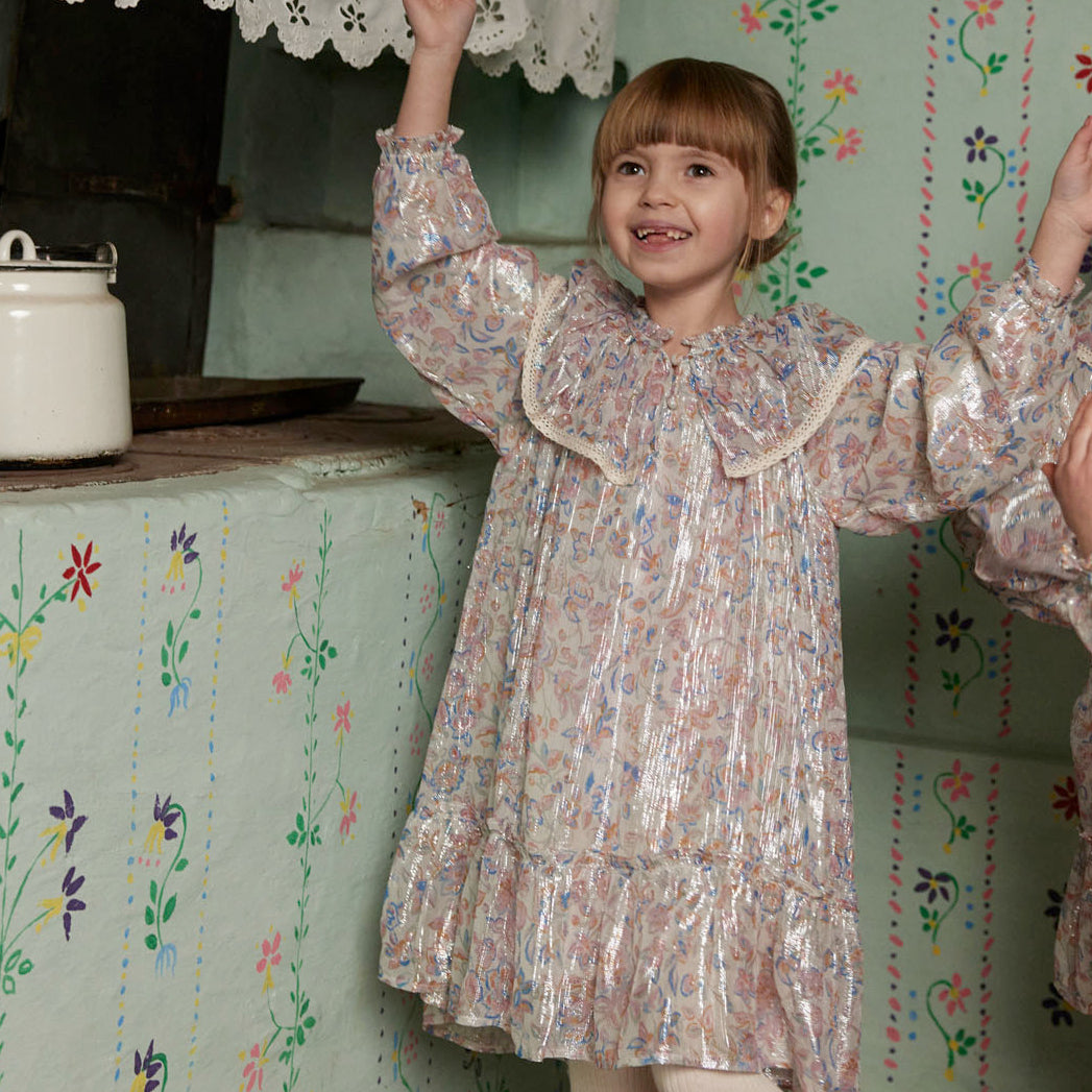 happy girl wearing a sparkly dress