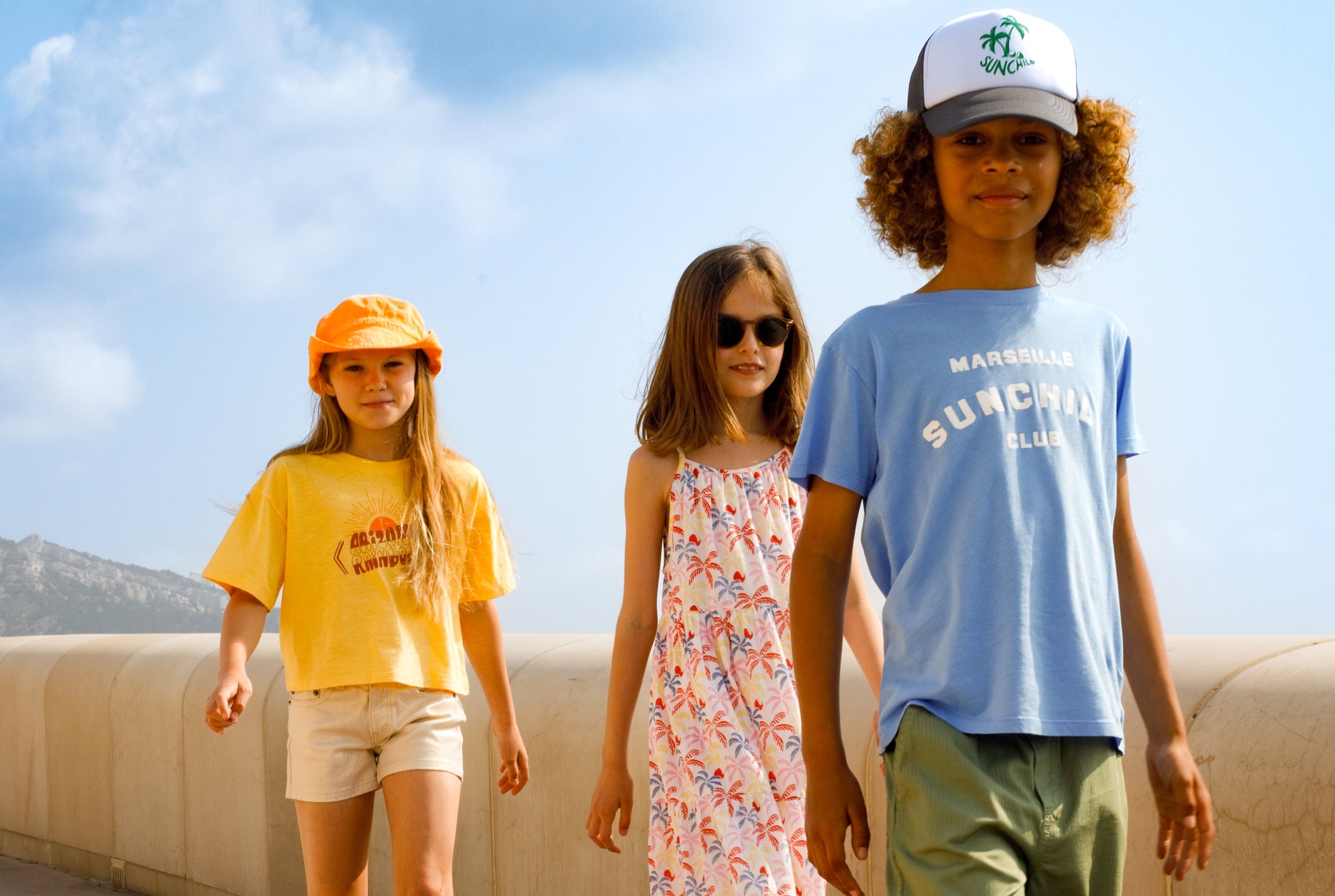 kids wearing sunchild clothing walking outside