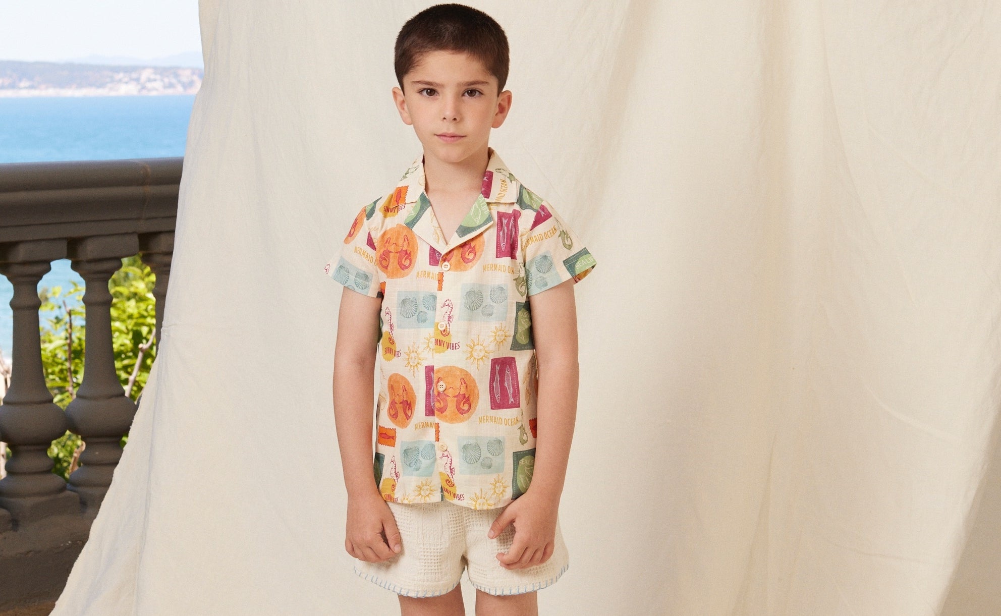 young boy wearing bebe organic luka shirt