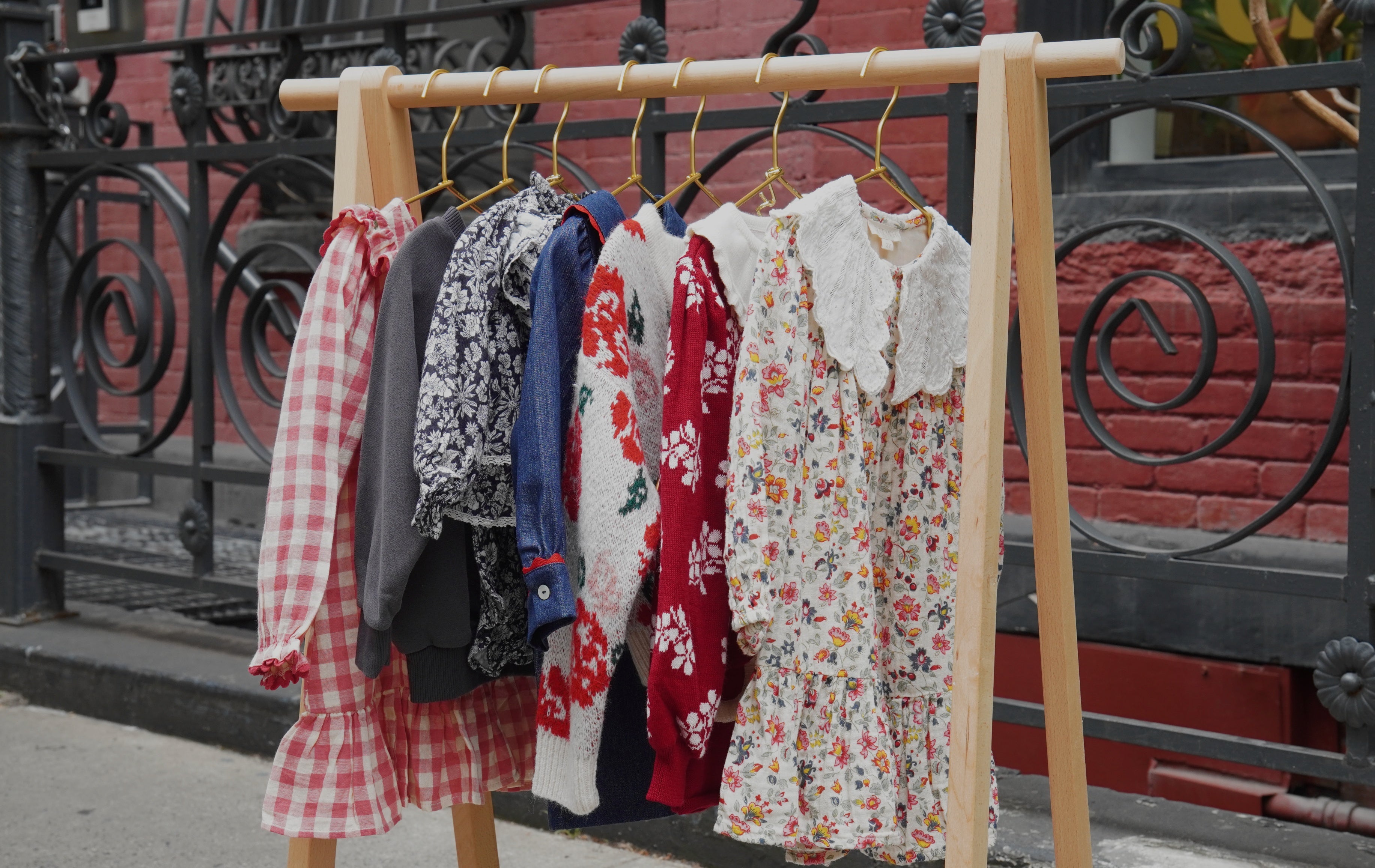 clothes on hanging rack in nyc street
